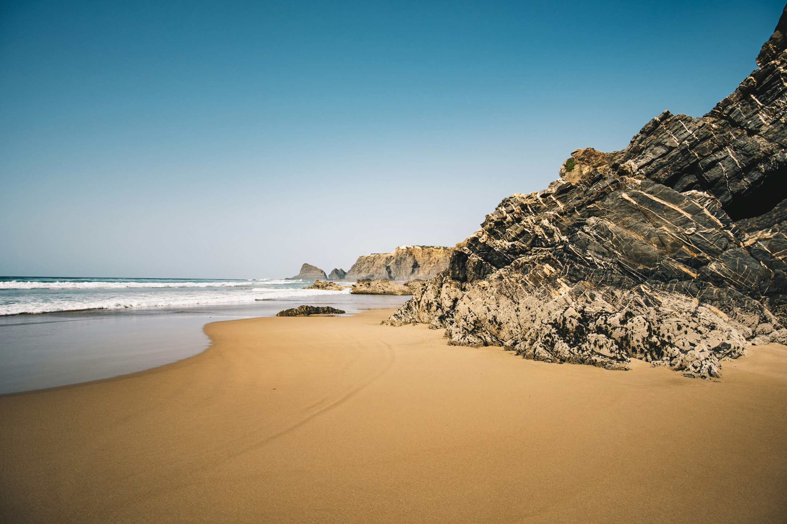 Algarve beach cliffs in Portugal for relocation and retirement planning