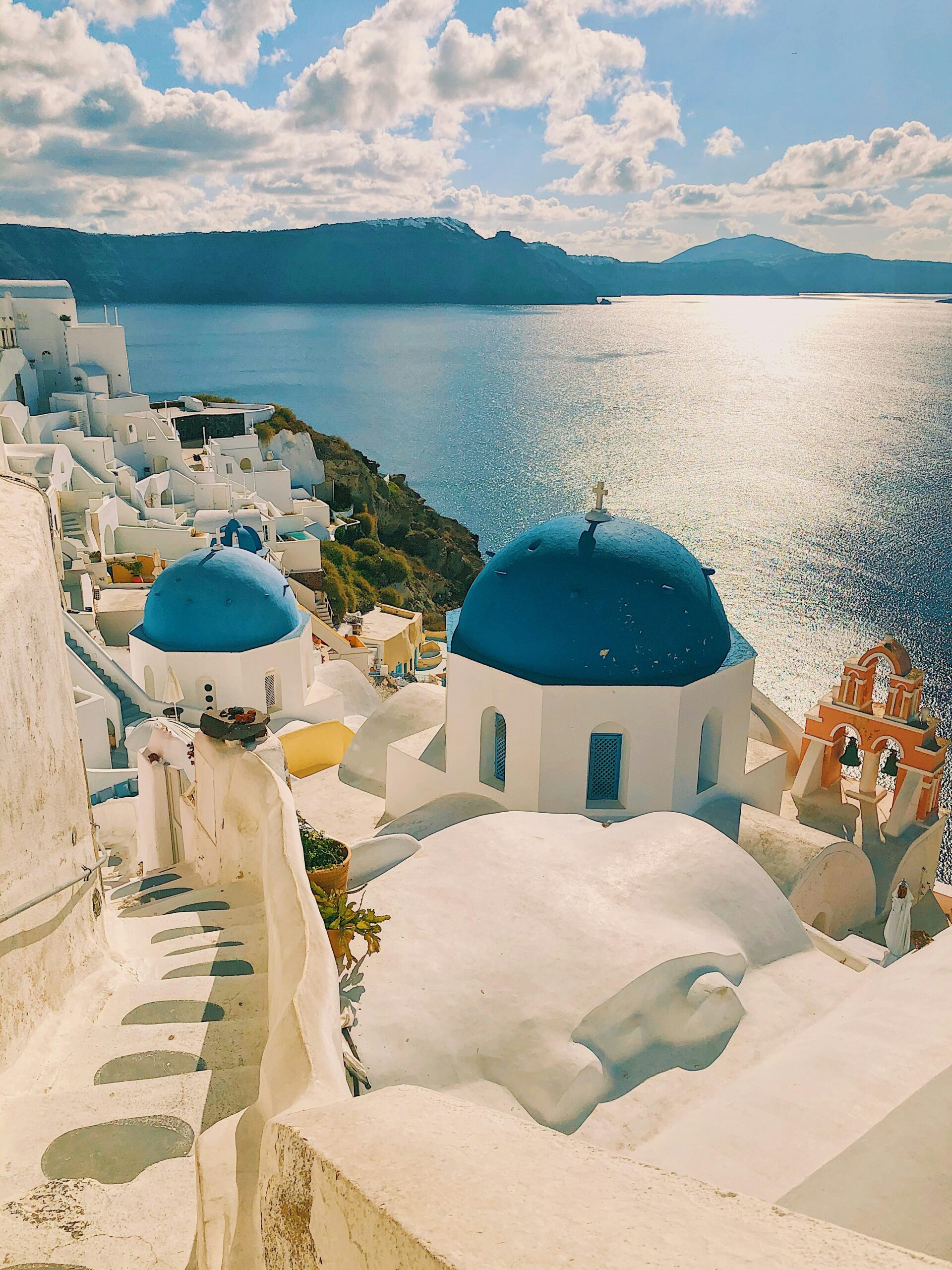 Santorini coastline in Greece with white buildings and blue sea