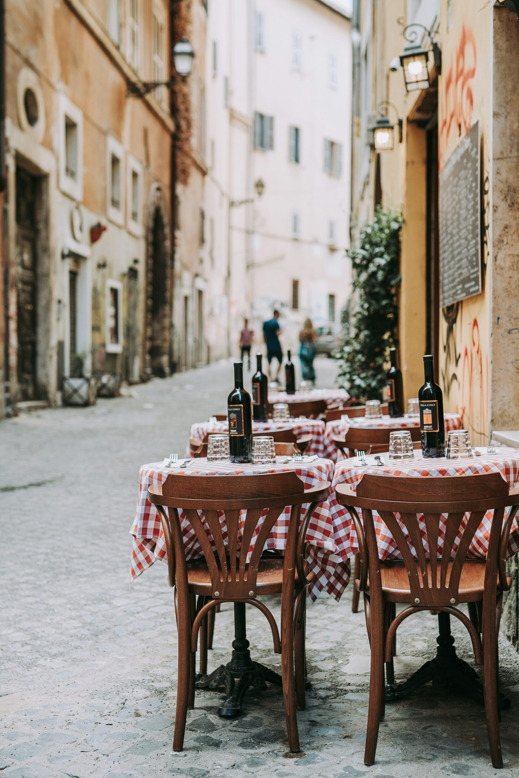 Italian street with cafes, old buildings and relaxed daily life
