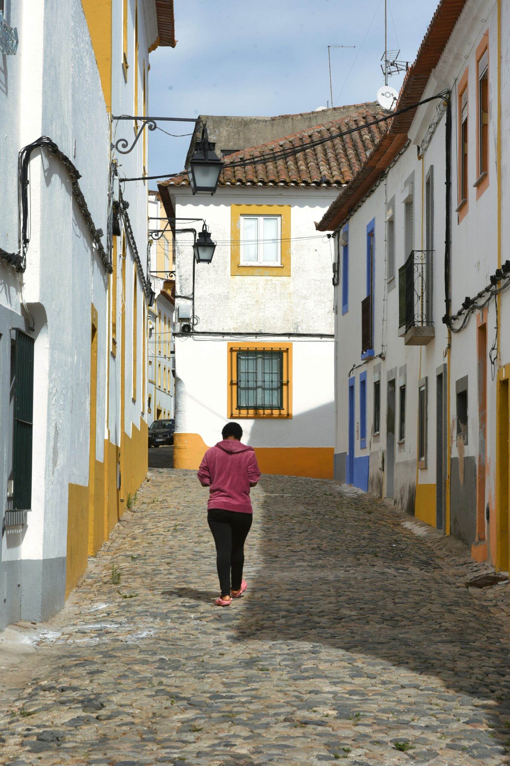 Quiet cobblestone street in Portugal for moving abroad lifestyle planning